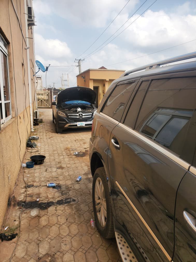 GEIYKE technician servicing a vehicle engine at our workshop
